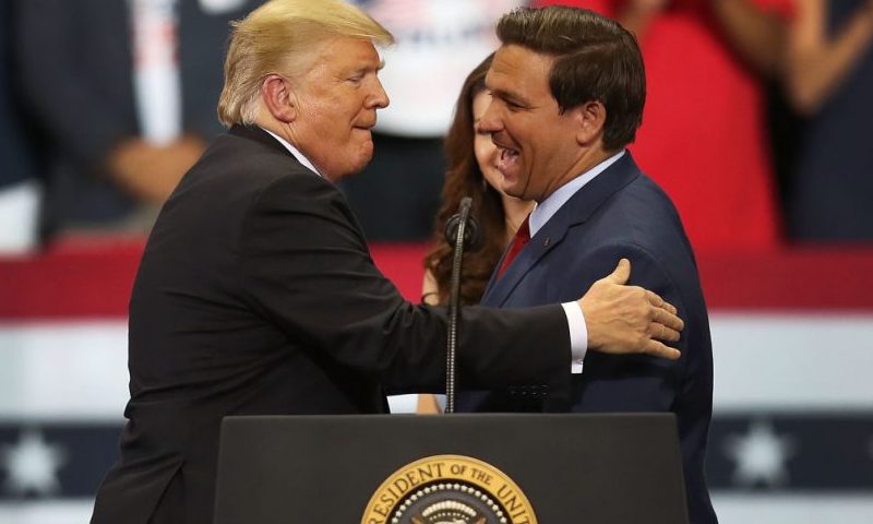ESTERO, FL - OCTOBER 31: President Donald Trump greets Florida Republican gubernatorial candidate Ron DeSantis during a campaign rally at the Hertz Arena on October 31, 2018 in Estero, Florida. President Trump continues traveling across America to help get the vote out for Republican candidates running for office. (Photo by Joe Raedle/Getty Images)