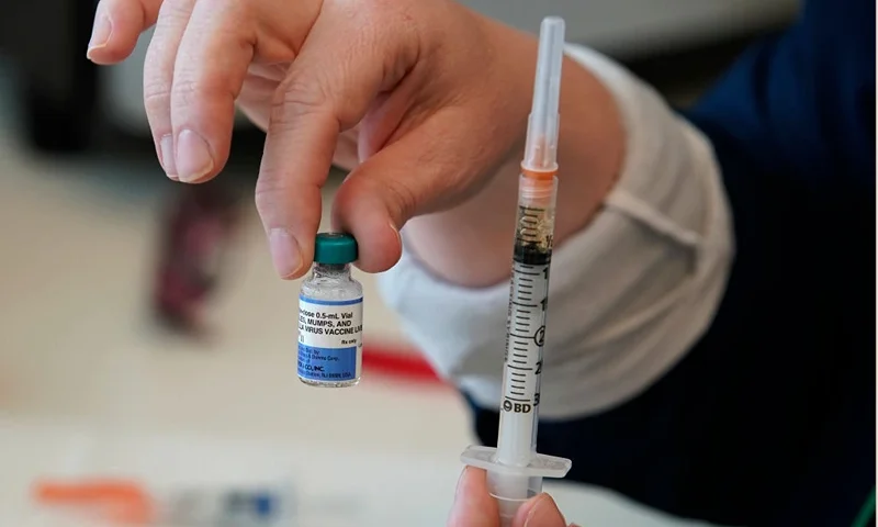 PROVO, UT - APRIL 29: A nurse holds up a one dose bottle and a prepared syringe of measles, mumps and rubella virus vaccine made by Merck at the Utah County Health Department on April 29, 2019 in Provo, Utah. These were Michaella's first ever vaccinations. She asked that only her first name be used. (Photo by George Frey/Getty Images)