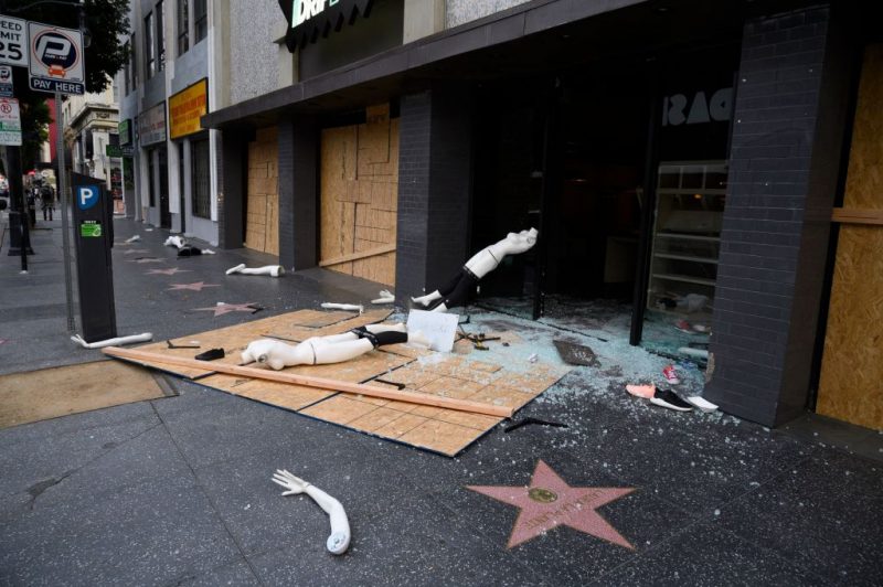 A mannequin is seen on the street after a store was broken into in Hollywood, California on June 1, 2020, after a third day of protests and looting in California. Most arrests were related to alleged looting. Major US cities -- convulsed by protests, clashes with police and looting since the death in Minneapolis police custody of George Floyd a week ago -- braced Monday for another night of unrest. More than 40 cities have imposed curfews after consecutive nights of tension that included looting and the trashing of parked cars. (Photo by Robyn Beck / AFP) (Photo by ROBYN BECK/AFP via Getty Images)