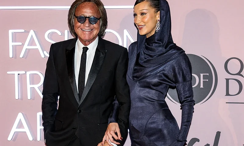US model Bella Hadid (R) and her father Mohamed Hadid arrive to attend the Fashion Trust Arabia Awards, a part of year-round cultural events culminating the FIFA World Cup Qatar 2022 football tournament, at the national museum of Qatar in Doha on October 26, 2022. (Photo by KARIM JAAFAR / AFP) (Photo by KARIM JAAFAR/AFP via Getty Images)