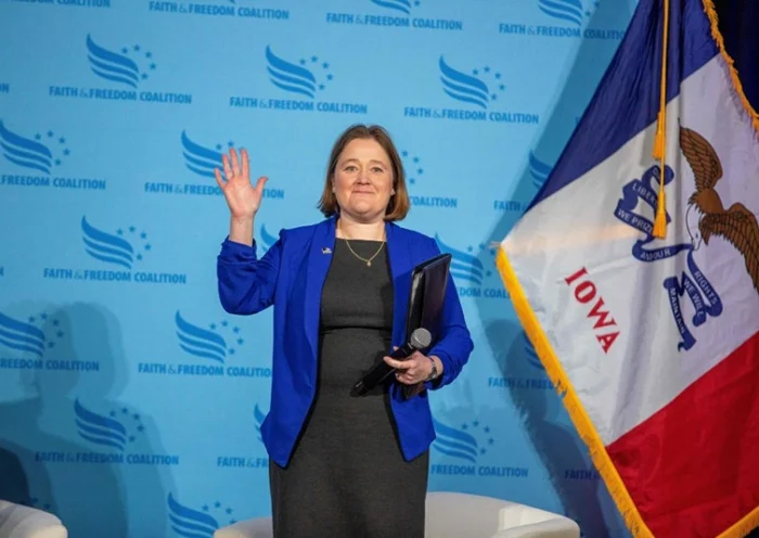 Iowa Attorney General Brenna Bird waves to the crowd during the Iowa Faith and Freedom Coalition's Road to Victory Conference at the Horizon Events Center in Clive, Iowa, on April 22, 2023. (Photo by Rachel MUMMEY / AFP) (Photo by RACHEL MUMMEY/AFP via Getty Images)