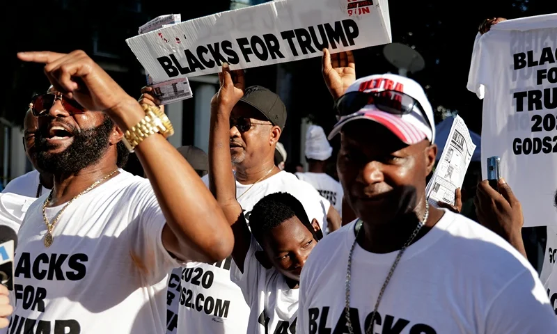 Former President Trump Is Arraigned On Federal Espionage Charges MIAMI, FLORIDA - JUNE 13: Blacks For Trump supporters stand outside the Wilkie D. Ferguson Jr. United States Federal Courthouse where former President Donald Trump is set to appear in front of a judge on June 13, 2023 in Miami, Florida. Trump is reported to have been indicted by a federal grand jury as part of special counsel Jack Smith's investigation into Trump's handling of classified documents. (Photo by Alon Skuy/Getty Images)