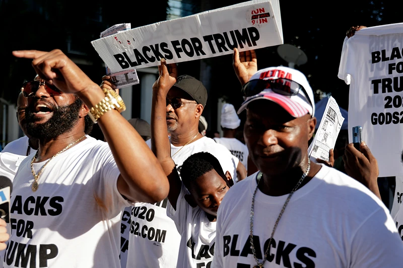 Former President Trump Is Arraigned On Federal Espionage Charges
MIAMI, FLORIDA - JUNE 13: Blacks For Trump supporters stand outside the Wilkie D. Ferguson Jr. United States Federal Courthouse where former President Donald Trump is set to appear in front of a judge on June 13, 2023 in Miami, Florida. Trump is reported to have been indicted by a federal grand jury as part of special counsel Jack Smith's investigation into Trump's handling of classified documents. (Photo by Alon Skuy/Getty Images)