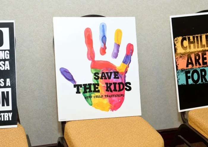 NEW YORK, NEW YORK - FEBRUARY 14: Signs on display as Cosmopolitan NYFW brings awareness against child sex trafficking at New Yorker Hotel on February 14, 2021 in New York City. (Photo by Noam Galai/Getty Images for Cosmopolitan NYFW)