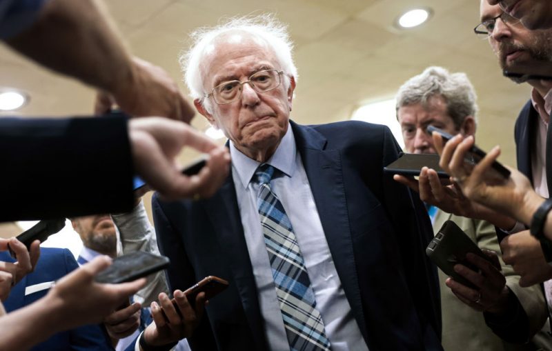 WASHINGTON, DC - JULY 21: U.S. Sen. Bernie Sanders (I-VT) talks to reporters as he walks to a vote at the U.S. Capitol on July 21, 2021 in Washington, DC. The Senate is expected to hold a cloture vote on the bipartisan infrastructure bill later today. (Photo by Kevin Dietsch/Getty Images)