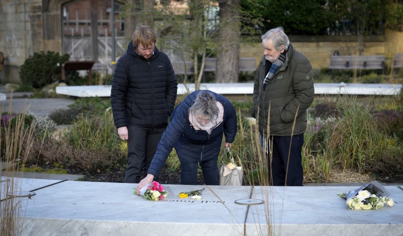 MANCHESTER, ENGLAND - MARCH 02: Relatives place flowers on the 'Glade of Light' memorial to the victims of the 2017 Manchester Arena bomb attack, after today's publication of the independent public inquiry investigating the deaths of the victims, on March 02, 2023 in Manchester, England. The independent public inquiry investigating the deaths of the victims of the 2017 Manchester Arena terror attack at an Ariana Grande concert is presided over by Sir John Saunders, the Coroner responsible for conducting the Inquests arising from the deaths of the 22 people killed. The third and final report of the inquiry, The final report, focusing on MI5 and police, is published today. (Photo by Christopher Furlong/Getty Images)