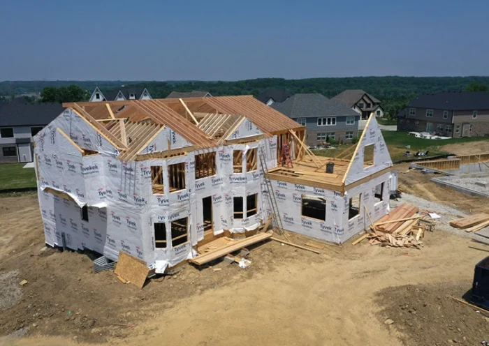 LEMONT, ILLINOIS - JUNE 21: A aerial view shows a home under construction at a housing development on June 21, 2023 in Lemont, Illinois. US housing starts climbed more than 20% last month which has helped lumber futures climb nearly 9% over the same period. According to the National Association of Home Builders, volatile prices of lumber products in recent years have caused the average price of a new single-family home to increase by more than $14,000. (Photo by Scott Olson/Getty Images)