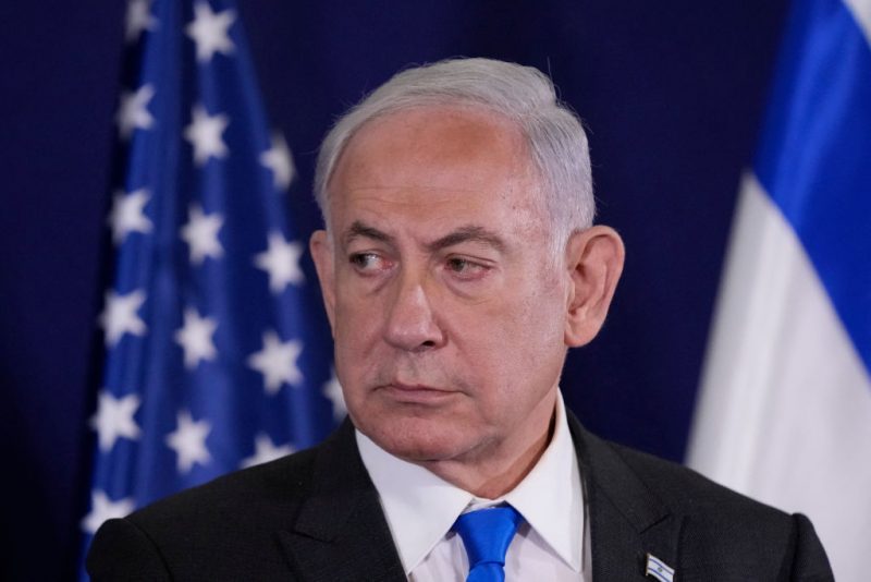 Israeli Prime Minister Benjamin Netanyahu looks on as the US Secretary of State gives statements to the media inside The Kirya, which houses the Israeli Defence Ministry, after their meeting in Tel Aviv on October 12, 2023. Blinken arrived in a show of solidarity after Hamas's surprise weekend onslaught in Israel, an AFP correspondent travelling with him reported. He is expected to visit Israeli Prime Minister Benjamin Netanyahu as Washington closes ranks with its ally that has launched a withering air campaign against Hamas militants in the Gaza Strip. (Photo by Jacquelyn Martin / POOL / AFP) (Photo by JACQUELYN MARTIN/POOL/AFP via Getty Images)
