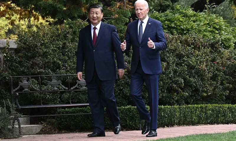 TOPSHOT - US President Joe Biden (R) and Chinese President Xi Jinping walk together after a meeting during the Asia-Pacific Economic Cooperation (APEC) Leaders' week in Woodside, California on November 15, 2023. Biden and Xi will try to prevent the superpowers' rivalry spilling into conflict when they meet for the first time in a year at a high-stakes summit in San Francisco on Wednesday. With tensions soaring over issues including Taiwan, sanctions and trade, the leaders of the world's largest economies are expected to hold at least three hours of talks at the Filoli country estate on the city's outskirts. (Photo by Brendan SMIALOWSKI / AFP) (Photo by BRENDAN SMIALOWSKI/AFP via Getty Images)