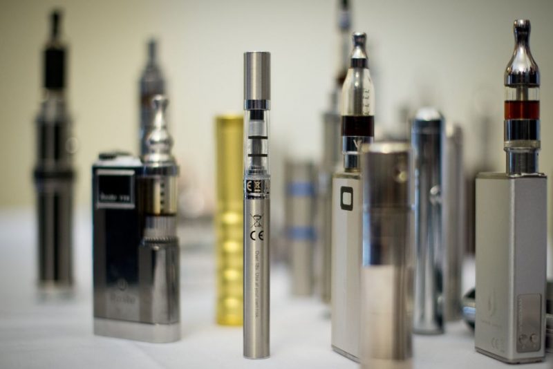 A selection of "Nicotine Containing Products", or "NCP"s are displayed during "The E-Cigarette Summit" at the Royal Academy in central London on November 12, 2013.  The merits of e-cigarettes were thrashed out at a one-day gathering of scientists, experts, policymakers and industry figures at the Royal Society in London. The use of electronic cigarettes -- pen-sized battery-powered devices that simulate smoking by heating and vaporising a liquid solution containing nicotine -- has grown rapidly.  AFP PHOTO / LEON NEAL / AFP PHOTO / LEON NEAL        (Photo credit should read LEON NEAL/AFP via Getty Images)