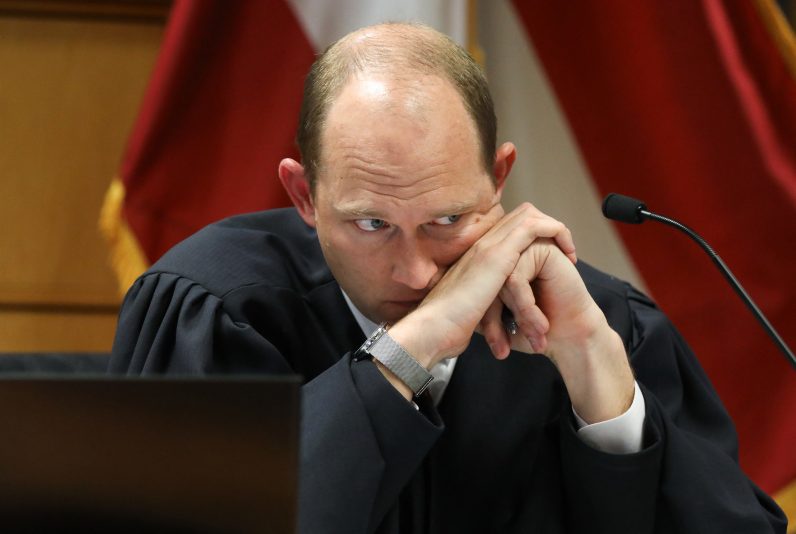 TOPSHOT-US-JUSTICE-POLITICS-TRUMP-GOERGIA
TOPSHOT - Fulton County Superior Judge Scott McAfee listens during a hearing into 'misconduct' allegations against Georgia prosecutor Fanni Willis at the Fulton County Courthouse in Atlanta, Georgia, on February 15, 2024. Willis, who brought election interference charges against former US President Donald Trump, acknowledged on February 2, 2024, that she had a romantic relationship with special prosecutor Nathan Wade, whom she hired to work on the high-profile case. (Photo by ALYSSA POINTER / POOL / AFP) (Photo by ALYSSA POINTER/POOL/AFP via Getty Images)
