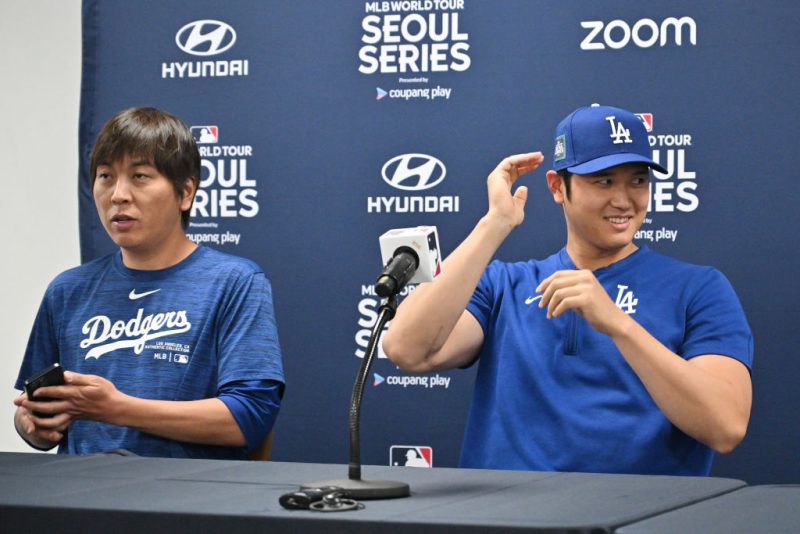 TOPSHOT - This picture taken on March 16, 2024 shows Los Angeles Dodgers' Shohei Ohtani (R) and his interpreter Ippei Mizuhara (L) attending a press conference at Gocheok Sky Dome in Seoul ahead of the 2024 MLB Seoul Series baseball game between Los Angeles Dodgers and San Diego Padres. The Los Angeles Dodgers said on March 21 they had fired Shohei Ohtani's interpreter after the Japanese baseball star's representatives claimed he had been the victim of 