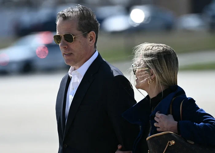 Hunter Biden, son of US President Joe Biden, and his wife Melissa Cohen Biden walk to board Air Force One at Joint Base Andrews, Maryland, on March 29, 2024. Biden is heading to Camp David, the presidential retreat in Maryland, for the Easter weekend. (Photo by Brendan SMIALOWSKI / AFP) (Photo by BRENDAN SMIALOWSKI/AFP via Getty Images)