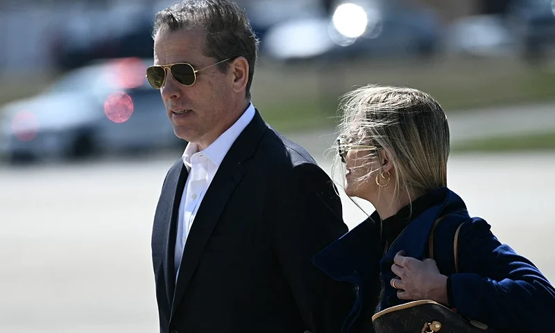 Hunter Biden, son of US President Joe Biden, and his wife Melissa Cohen Biden walk to board Air Force One at Joint Base Andrews, Maryland, on March 29, 2024. Biden is heading to Camp David, the presidential retreat in Maryland, for the Easter weekend. (Photo by Brendan SMIALOWSKI / AFP) (Photo by BRENDAN SMIALOWSKI/AFP via Getty Images)