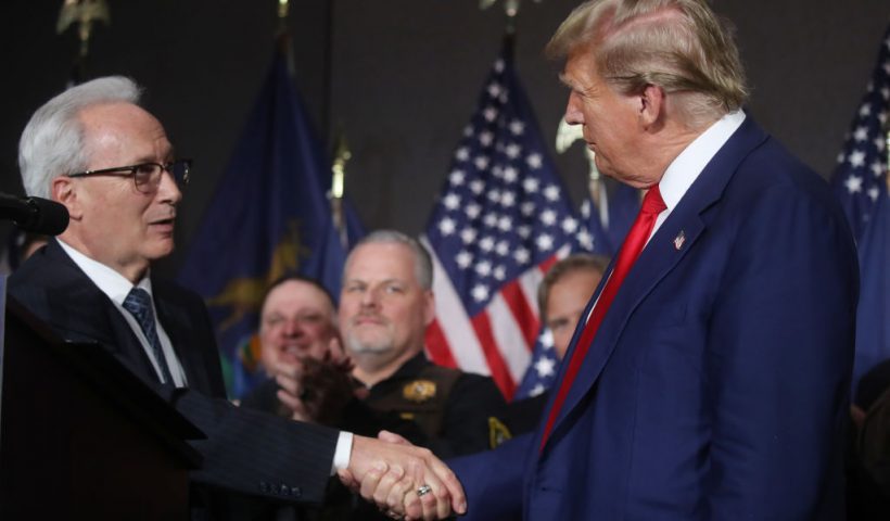 GRAND RAPIDS, MICHIGAN - APRIL 02: Former U.S. President Donald Trump speaks with James Tignanelli, with the Police Officers Association of Michigan as he attends a campaign event on April 02, 2024 in Grand Rapids, Michigan. Trump delivered a speech which his campaign has called "Biden's Border Bloodbath", as recent polls have shown that immigration and the situation at the U.S. Southern border continue to be top issues on voters' minds going into the November election. (Photo by Spencer Platt/Getty Images)