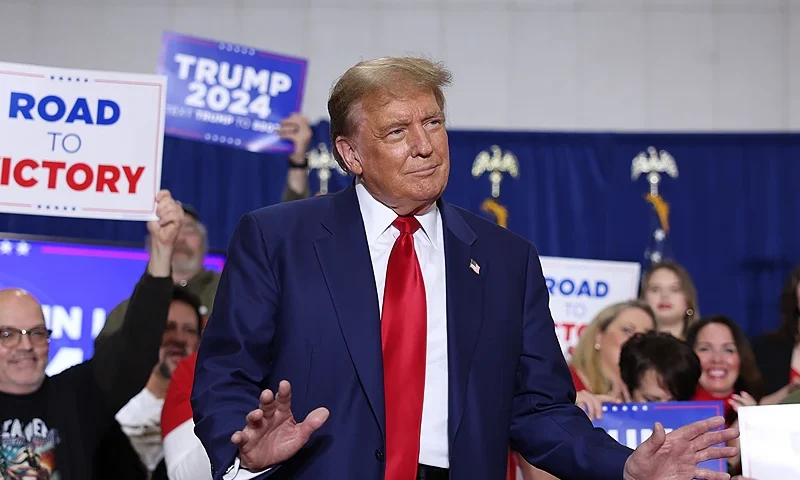 GREEN BAY, WISCONSIN - APRIL 02: Former President Donald Trump arrives for a rally on April 02, 2024 in Green Bay, Wisconsin. At the rally, Trump spoke next to an empty lectern on the stage and challenged President Joe Biden to debate him. The Wisconsin primary is being held today. (Photo by Scott Olson/Getty Images)