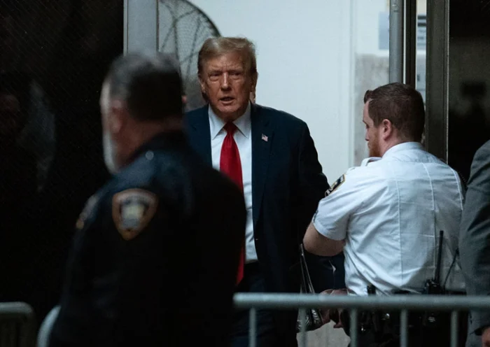 NEW YORK, NEW YORK - APRIL 15: Former U.S. President Donald Trump returns to the courtroom after a break during the start of jury selection for his trial at Manhattan Criminal Court on April 15, 2024 in New York City. Former President Donald Trump faces 34 felony counts of falsifying business records in the first of his criminal cases to go to trial. (Photo by Jeenah Moon-Pool/Getty Images)