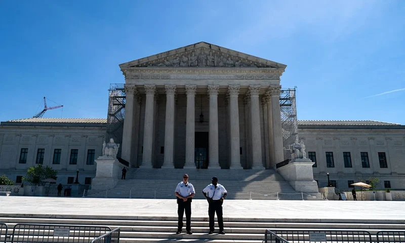 WASHINGTON, DC - APRIL 16: Supreme Court Police officers stand on the steps of the nation's high court as supporters of January 6 defendants including Micki Witthoeft, the mother of Ashli Babbitt, who was killed on January 6, 2021, gather outside of the Supreme Court on April 16, 2024 in Washington, DC. The Supreme Court is hearing oral arguments in Fischer v. U.S., a case about whether the U.S. Court of Appeals for the District of Columbia Circuit erred in applying a specific part of U.S. criminal code when charging January 6 defendants. (Photo by Kent Nishimura/Getty Images)