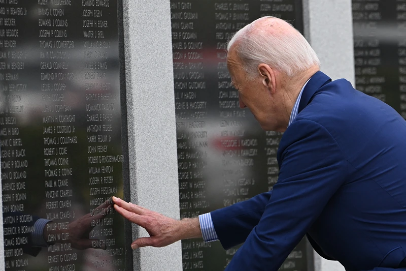 US-VOTE-POLITICS-BIDEN
US President Joe Biden pays respects to his uncle World War II veteran Ambrose J, Finnegan, Jr. at the Veterans War Memorial in Scranton, Pennsylvania, before departing for Pittsburgh, on April 17, 2024. Biden is traveling to Pittsburgh, Pennsylvania, to meet with steelworkers. (Photo by ANDREW CABALLERO-REYNOLDS / AFP) (Photo by ANDREW CABALLERO-REYNOLDS/AFP via Getty Images)