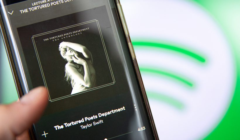This photograph taken in Paris on April 19, 2024, shows a smatphone displaying the US singer-songwriter Taylor Swift's new album "The Tortured Poets Department" on Spotify. Queen of pop Taylor Swift released her highly anticipated record "The Tortured Poets Department" on April 19, 2024 -- the 11th studio album from the megastar who is already having a blockbuster year. Swift announced the album's release at the Grammys in February, a night that saw the 34-year-old billionaire win a record-breaking fourth Album of the Year prize. (Photo by Antonin UTZ / AFP) (Photo by ANTONIN UTZ/AFP via Getty Images)