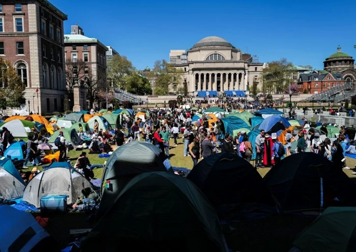 People rally on the campus of Columbia University which is occupied by pro-Palestian protesters in New York on April 22, 2024. US President Joe Biden condemned any anti-Semitism on college campuses on April 21, 2024 as pro-Palestinian protesters at Columbia University spent their fifth day demanding the school sever financial ties with key US ally Israel. (Photo by Charly TRIBALLEAU / AFP) (Photo by CHARLY TRIBALLEAU/AFP via Getty Images)