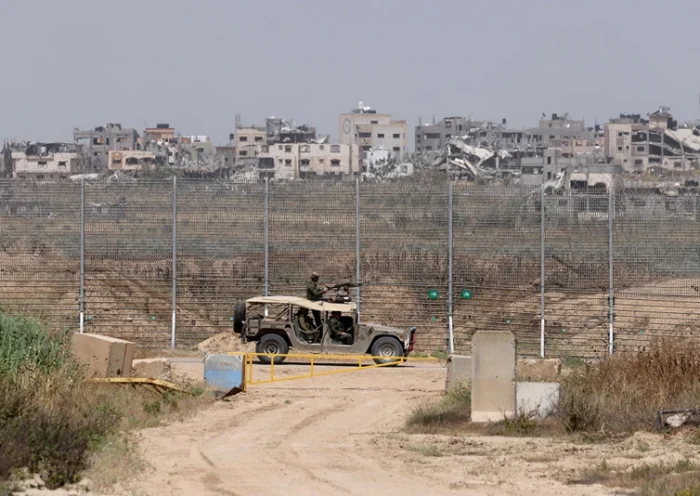 This picture taken from Israel's southern border with the Gaza Strip shows an Israeli military vehicle along the border with the Palestinian territory on April 24, 2024, amid the ongoing conflict between Israel and the militant group Hamas. (Photo by JACK GUEZ / AFP) (Photo by JACK GUEZ/AFP via Getty Images)