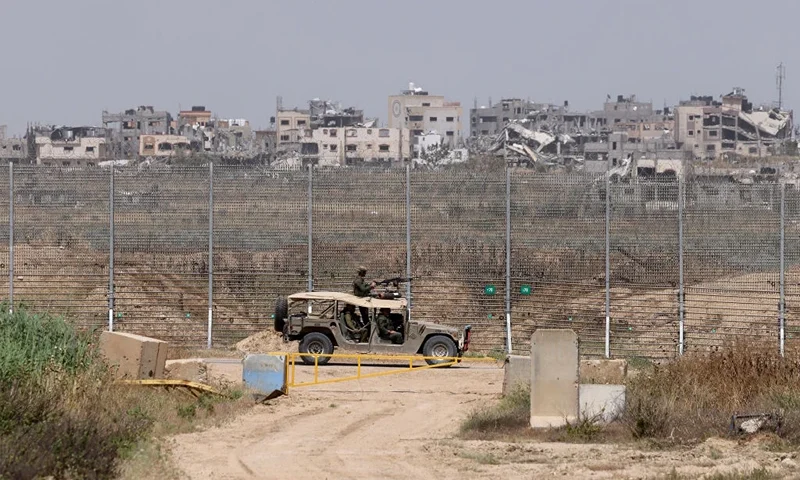 This picture taken from Israel's southern border with the Gaza Strip shows an Israeli military vehicle along the border with the Palestinian territory on April 24, 2024, amid the ongoing conflict between Israel and the militant group Hamas. (Photo by JACK GUEZ / AFP) (Photo by JACK GUEZ/AFP via Getty Images)