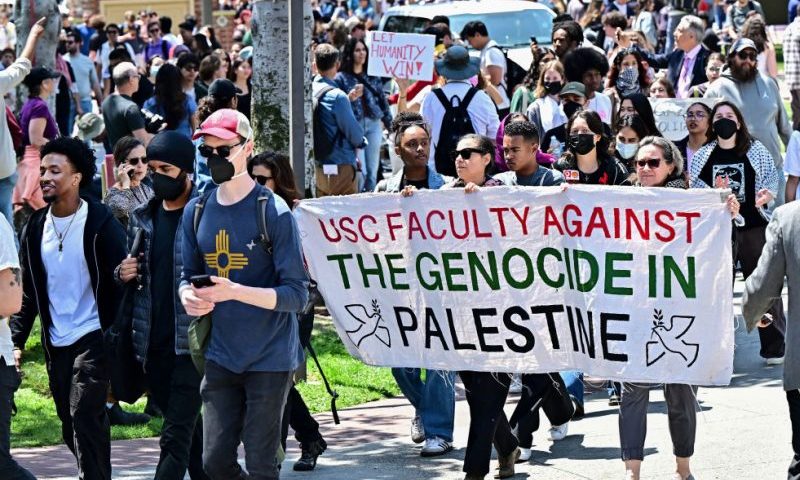 Faculty join pro-Palestinian students as they protest the Israel-Hamas war on the campus of the University of Southern California in Los Angeles, on April 24, 2024. Universities have become the focus of intense cultural debate in the United States since the October 7 Hamas attack and Israel's overwhelming military response to it. (Photo by Frederic J. BROWN / AFP) (Photo by FREDERIC J. BROWN/AFP via Getty Images)