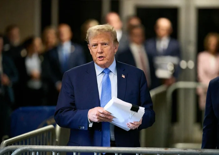 NEW YORK, NEW YORK - APRIL 26: Former U.S. President Donald Trump speaks to the media as he arrives to court during his trial for allegedly covering up hush money payments at Manhattan Criminal Court on April 26, 2024 in New York City. Former U.S. President Donald Trump faces 34 felony counts of falsifying business records in the first of his criminal cases to go to trial. (Photo by Curtis Means-Pool/Getty Images)
