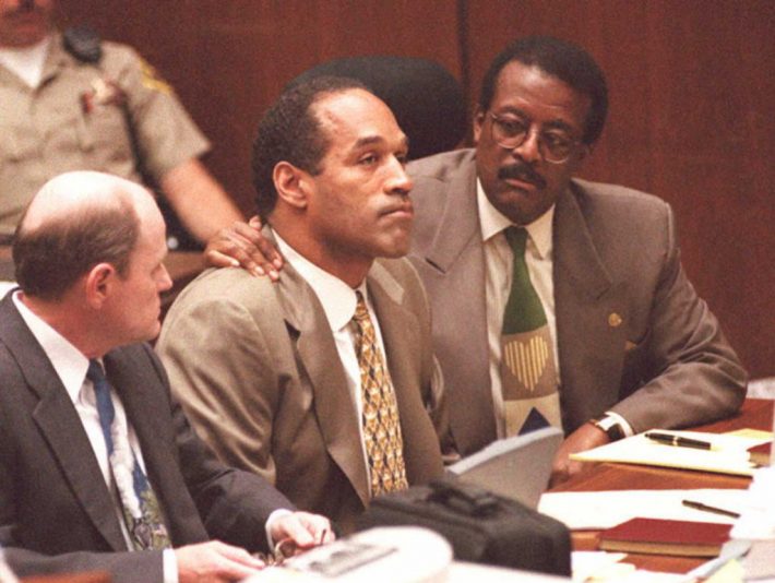 LOS ANGELES, CA - SEPTEMBER 22: Lead defense attorney Johnnie Cochran (R) puts his arm on O.J. Simpson's shoulder after Simpson told Judge Lance Ito 22 September that he has faith that jurors will acquit him of the murder of his ex-wife Nicole Simpson and her friend, Ronald Goldman. At left is defense attorney Robert Blasier. AFP PHOTO (Photo credit should read POO/AFP via Getty Images)