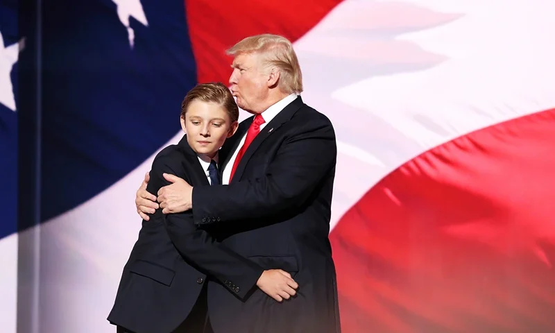 Republican National Convention: Day Four CLEVELAND, OH - JULY 21: Republican presidential candidate Donald embraces his son Barron Trump after he delivered his speech on the fourth day of the Republican National Convention on July 21, 2016 at the Quicken Loans Arena in Cleveland, Ohio. Republican presidential candidate Donald Trump received the number of votes needed to secure the party's nomination. An estimated 50,000 people are expected in Cleveland, including hundreds of protesters and members of the media. The four-day Republican National Convention kicked off on July 18. (Photo by John Moore/Getty Images)