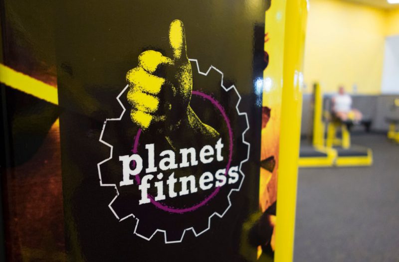 A woman leg lifts at Planet Fitness in the Columbia Mall on July 24, 2017 in Bloomsburg, Pennsylvania. - Mall space is being repurposed as more department store chains close stores that have traditionally served as 