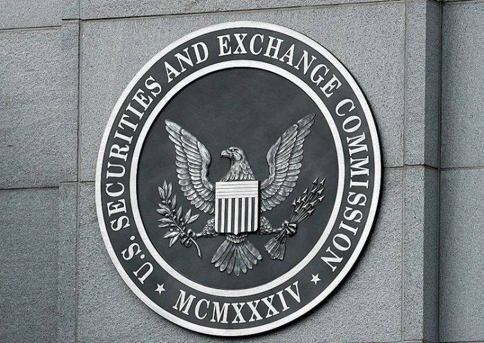 WASHINGTON - SEPTEMBER 18: The U.S. Securities and Exchange Commission seal hangs on the facade of its building September 18, 2008 in Washington, DC. Republican presidential candidate Sen. John McCain (R-AZ) has called for the ouster of SEC Chairman Christopher Cox in the wake of the collapse of several giant banks on Wall Street and the resulting financial crisis. (Photo by Chip Somodevilla/Getty Images)