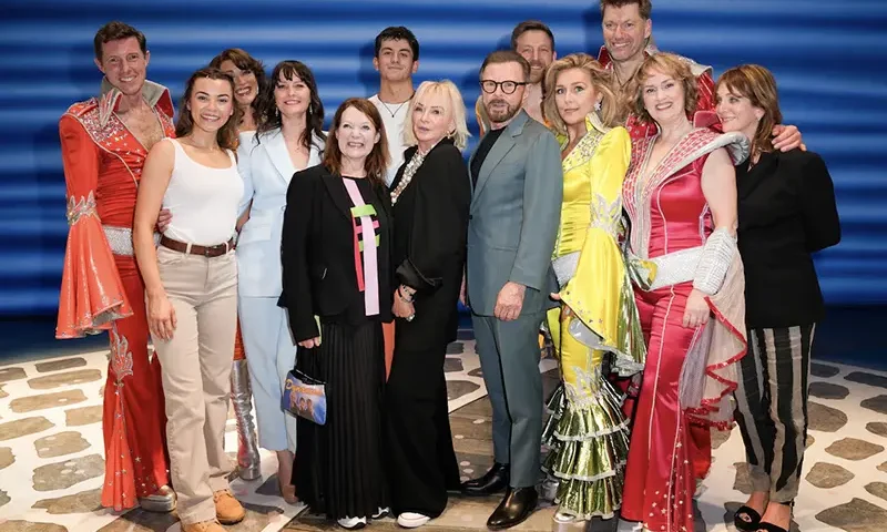 Cast members pose with writer Catherine Johnson, Bjorn Ulvaeus and Judy Craymer during the curtain call for Mamma Mia, as the musical celebrates 25 years, at the Novello Theatre in London, Britain, April 6, 2024. REUTERS/Maja Smiejkowska