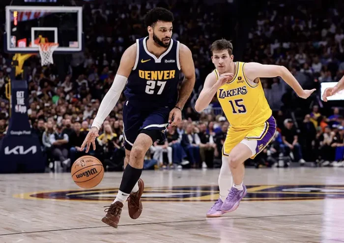 Denver Nuggets guard Jamal Murray (27) controls the ball ahead of Los Angeles Lakers guard Austin Reaves (15) in the third quarter during game five of the first round for the 2024 NBA playoffs at Ball Arena. Mandatory Credit: Isaiah J. Downing-USA TODAY Sports