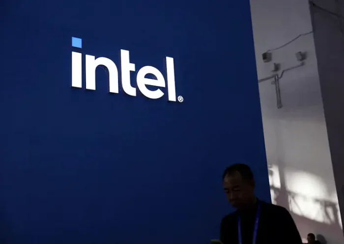 A man walks past the Intel logo at its booth during the first China International Supply Chain Expo (CISCE) in Beijing, China November 28, 2023. REUTERS/Florence Lo/File Photo