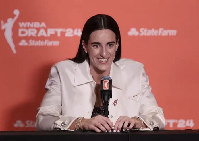 Caitlin Clark speaks in a press conference after she is selected with the number one overall pick to the Indiana Fever n the 2024 WNBA Draft at Brooklyn Academy of Music. Mandatory Credit: Vincent Carchietta-USA TODAY Sports