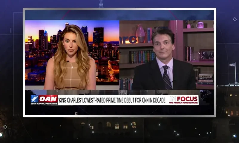 Video still from In Focus on One America News Network showing a split screen of the host on the left side, and on the right side is the guest, Eric Scheiner.