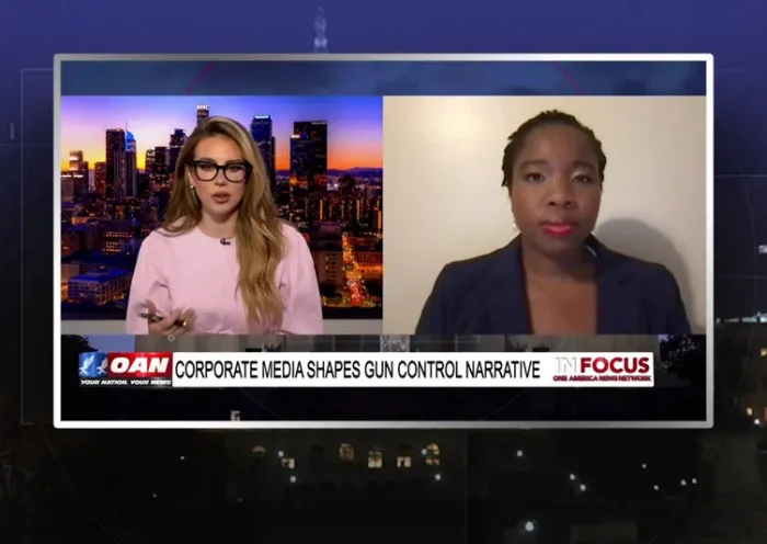 Video still from In Focus on One America News Network showing a split screen of the host on the left side, and on the right side is the guest, Antonia Cover.