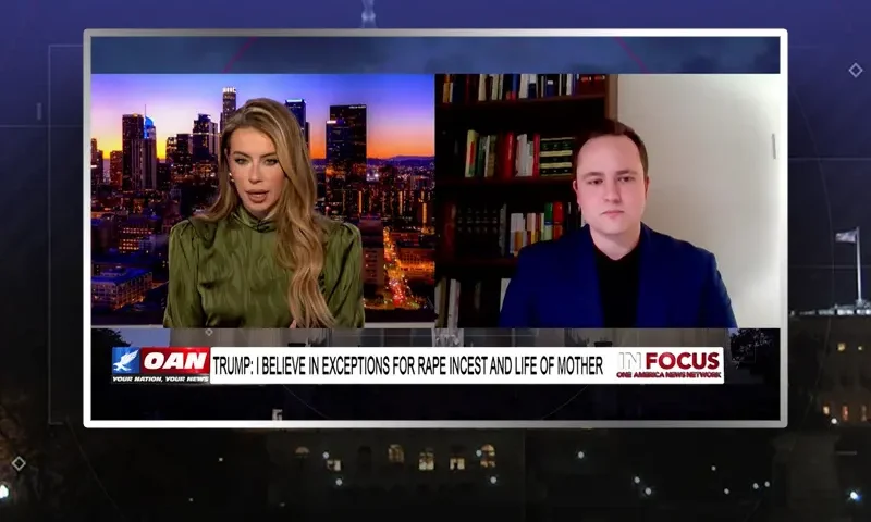 Video still from In Focus on One America News Network showing a split screen of the host on the left side, and on the right side is the guest, Ben Zeisloft.