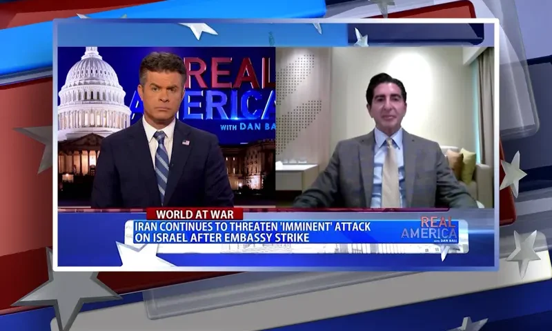Video still from Real America on One America News Network showing a split screen of the host on the left side, and on the right side is the guest, Harley Lippman.