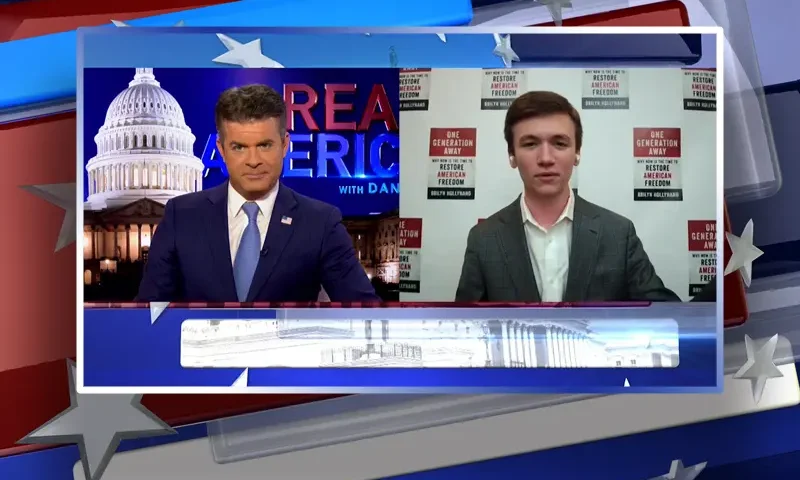 Video still from Real America on One America News Network showing a split screen of the host on the left side, and on the right side is the guest, Brilyn Hollyhand.