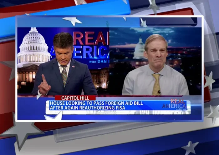 Video still from Real America on One America News Network showing a split screen of the host on the left side, and on the right side is the guest, Rep. Jim Jordan.