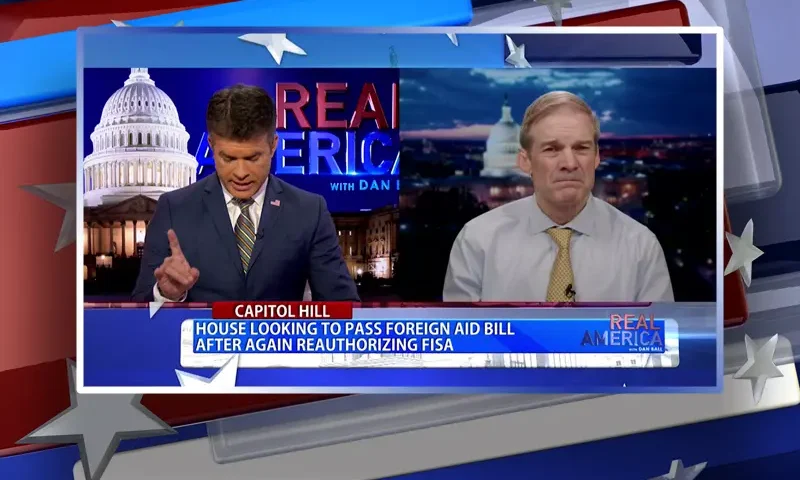 Video still from Real America on One America News Network showing a split screen of the host on the left side, and on the right side is the guest, Rep. Jim Jordan.