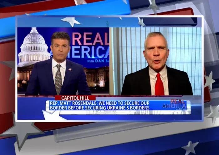 Video still from Real America on One America News Network showing a split screen of the host on the left side, and on the right side is the guest, Matt Rosendale.