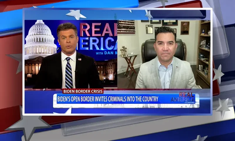 Video still from Real America on One America News Network showing a split screen of the host on the left side, and on the right side is the guest, Victor Avila.