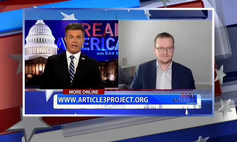 Video still from Real America on One America News Network showing a split screen of the host on the left side, and on the right side is the guest, Will Chamberlain.