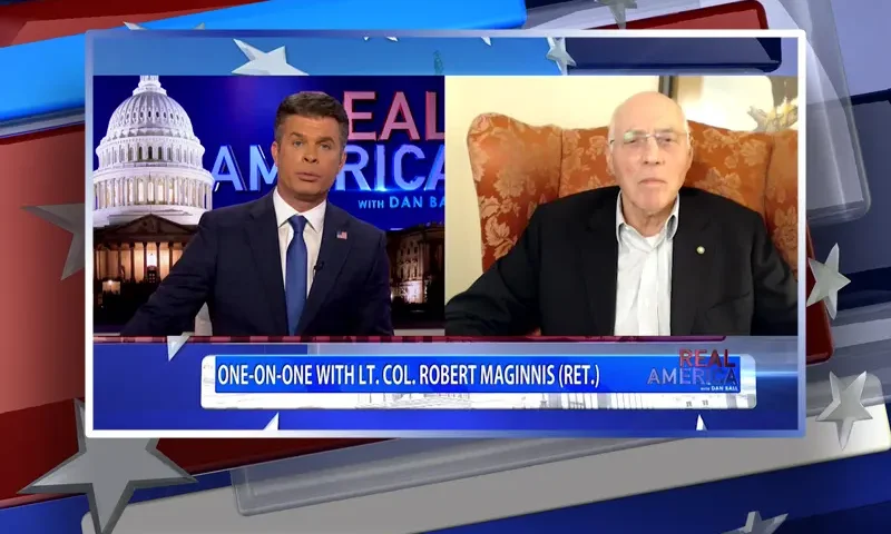 Video still from Real America on One America News Network showing a split screen of the host on the left side, and on the right side is the guest, Lt. Col. Robert Maginnis.