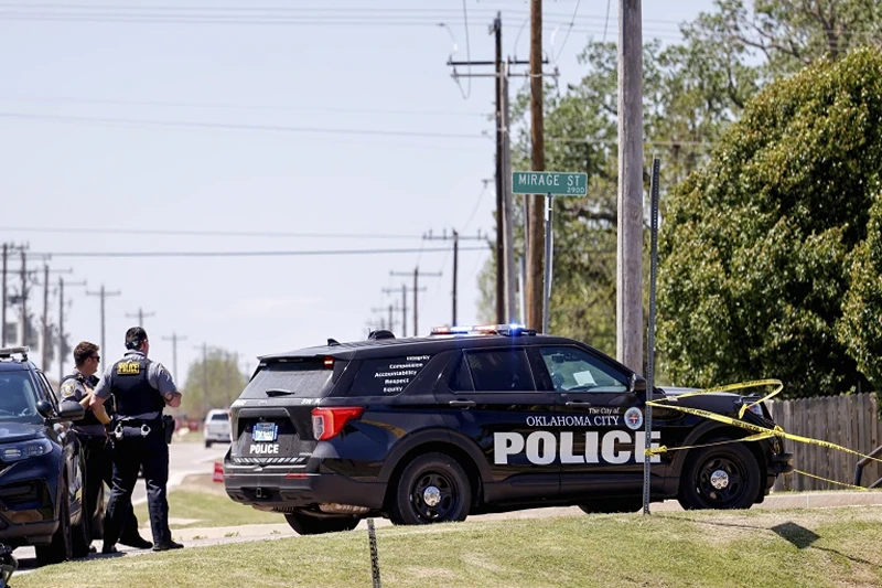 of 2 | Police investigate after people were found dead in a home in Oklahoma City on Monday, April 22, 2024. Oklahoma City police called to a home on the city's southwest side Monday discovered the bodies of five people, including at least two children, authorities said. (Nathan J. Fish/The Oklahoman via AP)