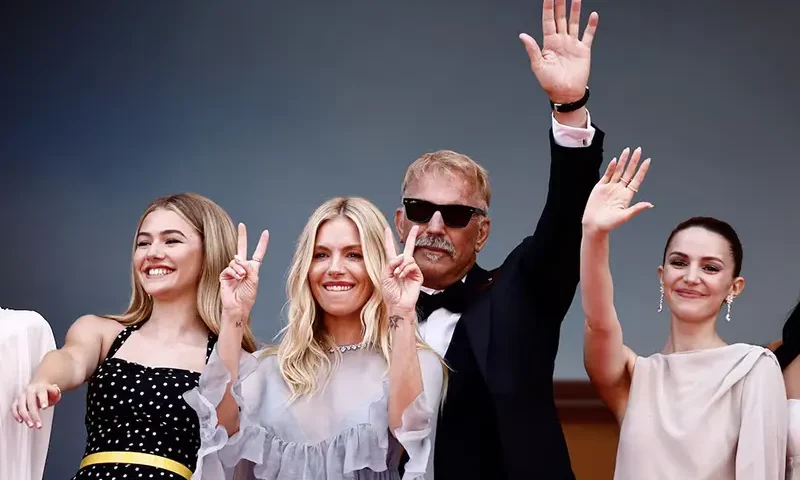 Director Kevin Costner and cast members Georgia MacPhail, Ella Hunt, and Sienna Miller pose on the red carpet during arrivals for the screening of the film "Horizon: An American Saga - Chapter 1" Out of competition at the 77th Cannes Film Festival in Cannes, France, May 19, 2024. REUTERS/Yara Nardi